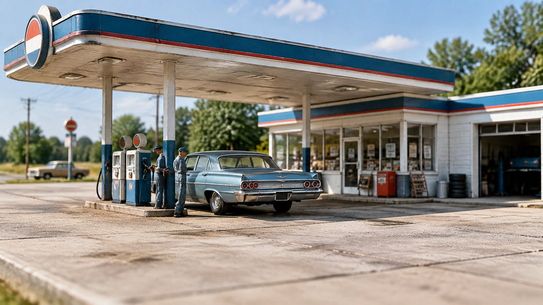 A mid-1960s 1:64 scale gas station diorama with a period diecast car at the pump and a uniformed attendant