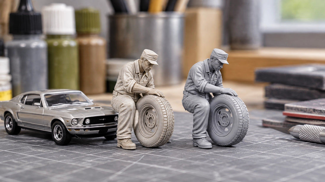 Unpainted and primed 1:64 resin figures beside a diecast car on a hobby workbench