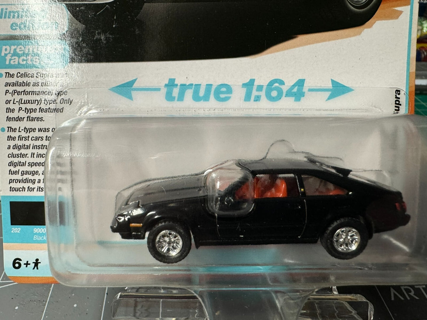 1:64 AutoWorld Premium 2024 R2A - 1983 Toyota Celica Supra in Black # AW64442A